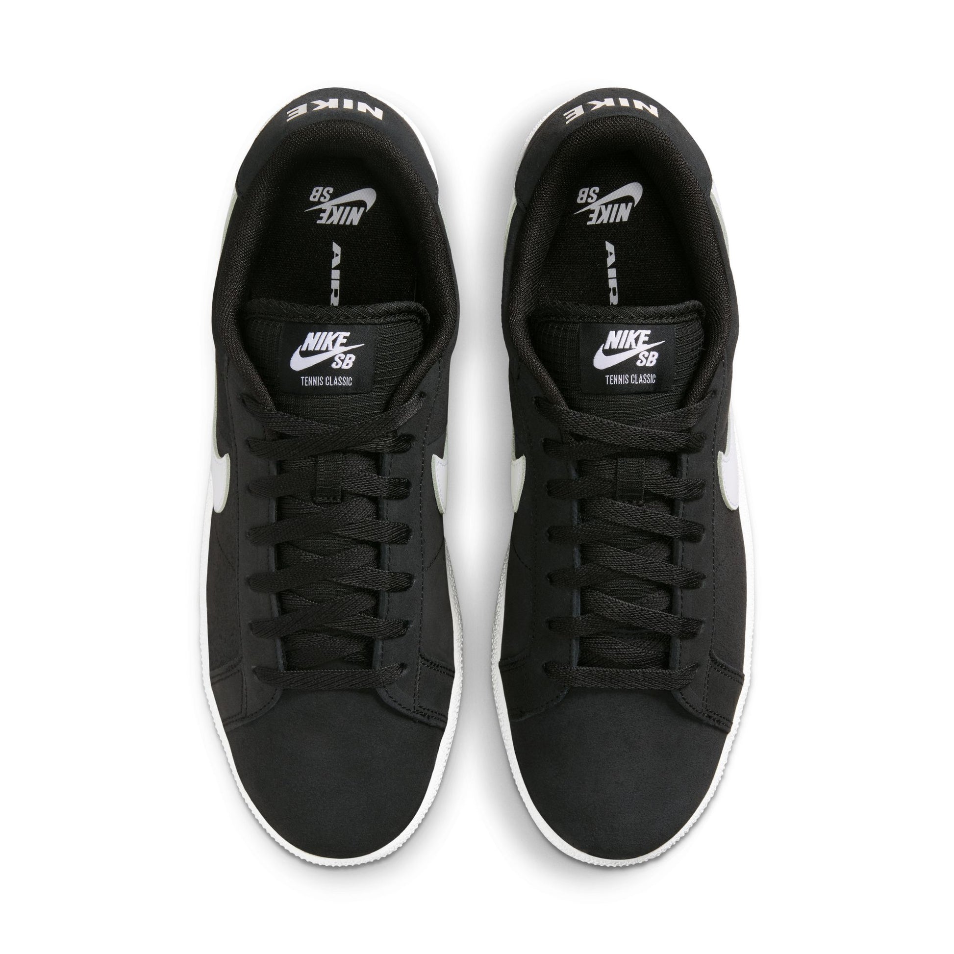 Black Nike SB sneakers with white accents on a white background