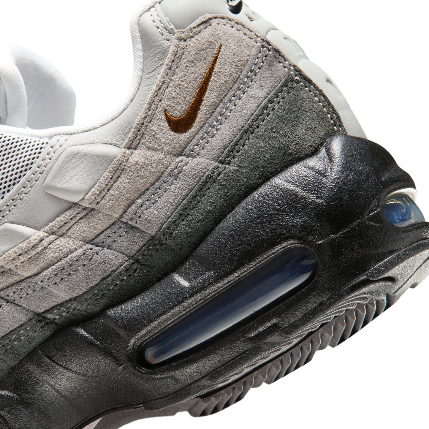 Close-up of a Nike sneaker with a focus on the air cushion and brand logo.