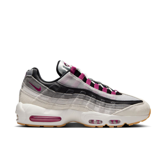 Sneaker with pink and black accents on a white background