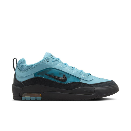 side view of blue and black suede ishod max skateboard shoe with black sole