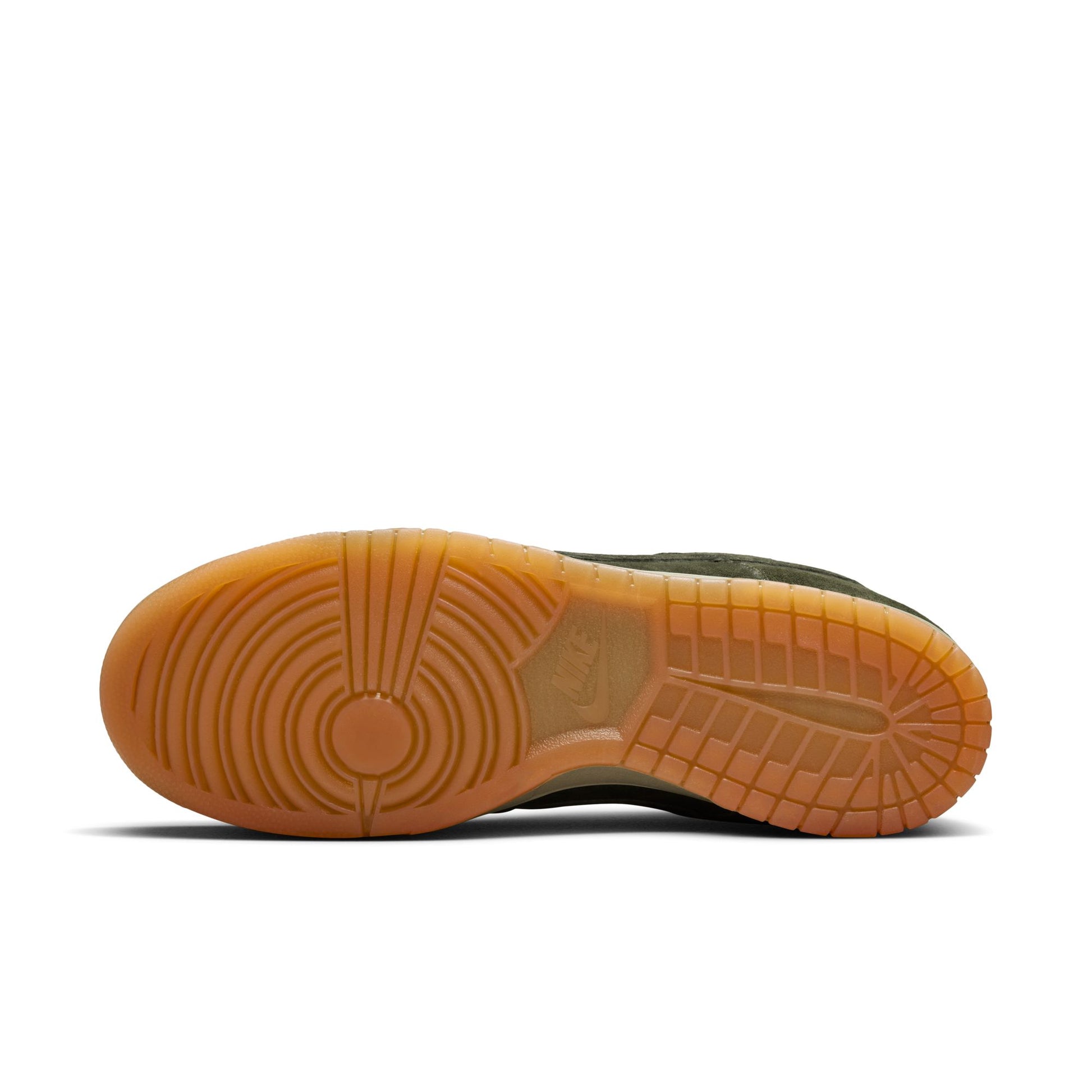 Close-up of a shoe sole with brown rubber outsole on a white background