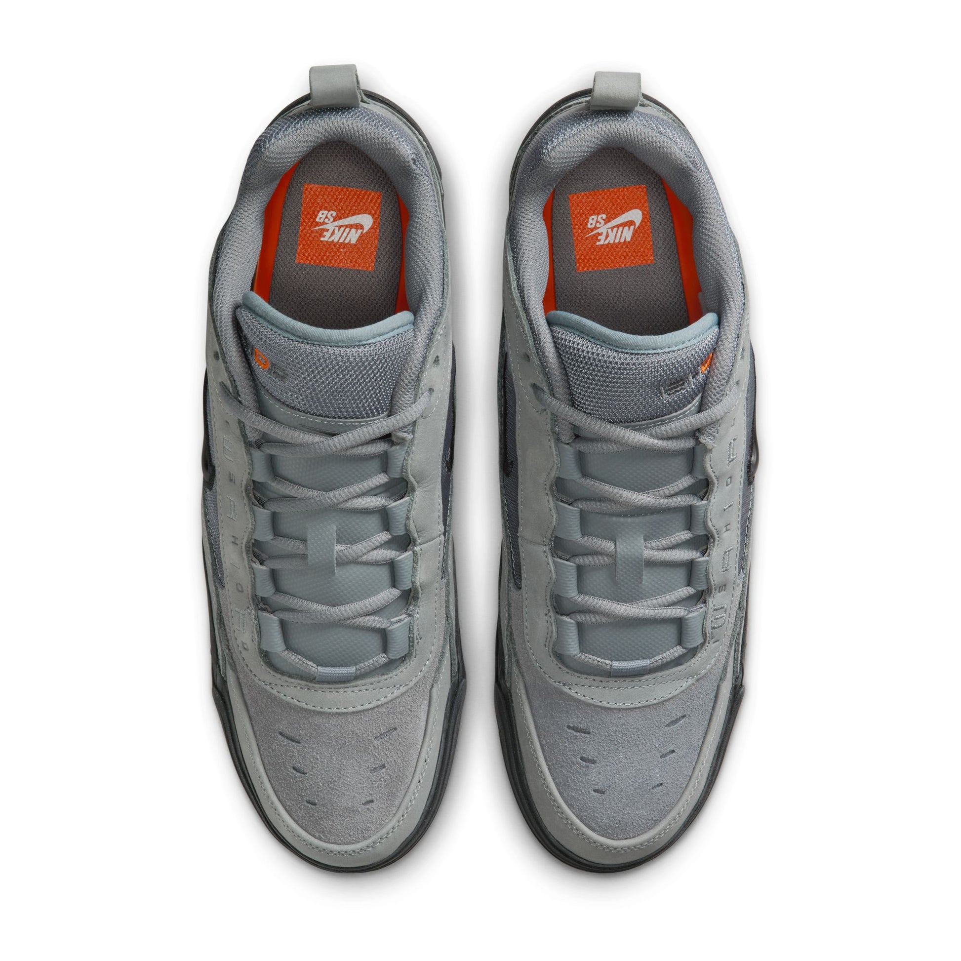 Gray sneakers with orange accents on a white background