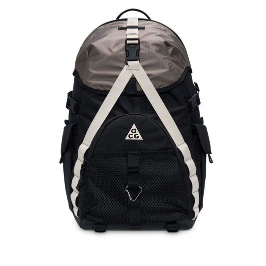 Black and gray backpack with a visible ACG brand logo on a white background