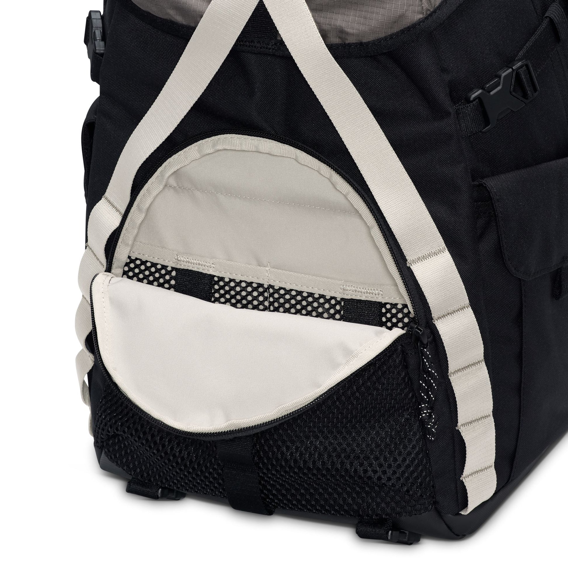 close up view of Black and white bag with mesh side pocket on a white background