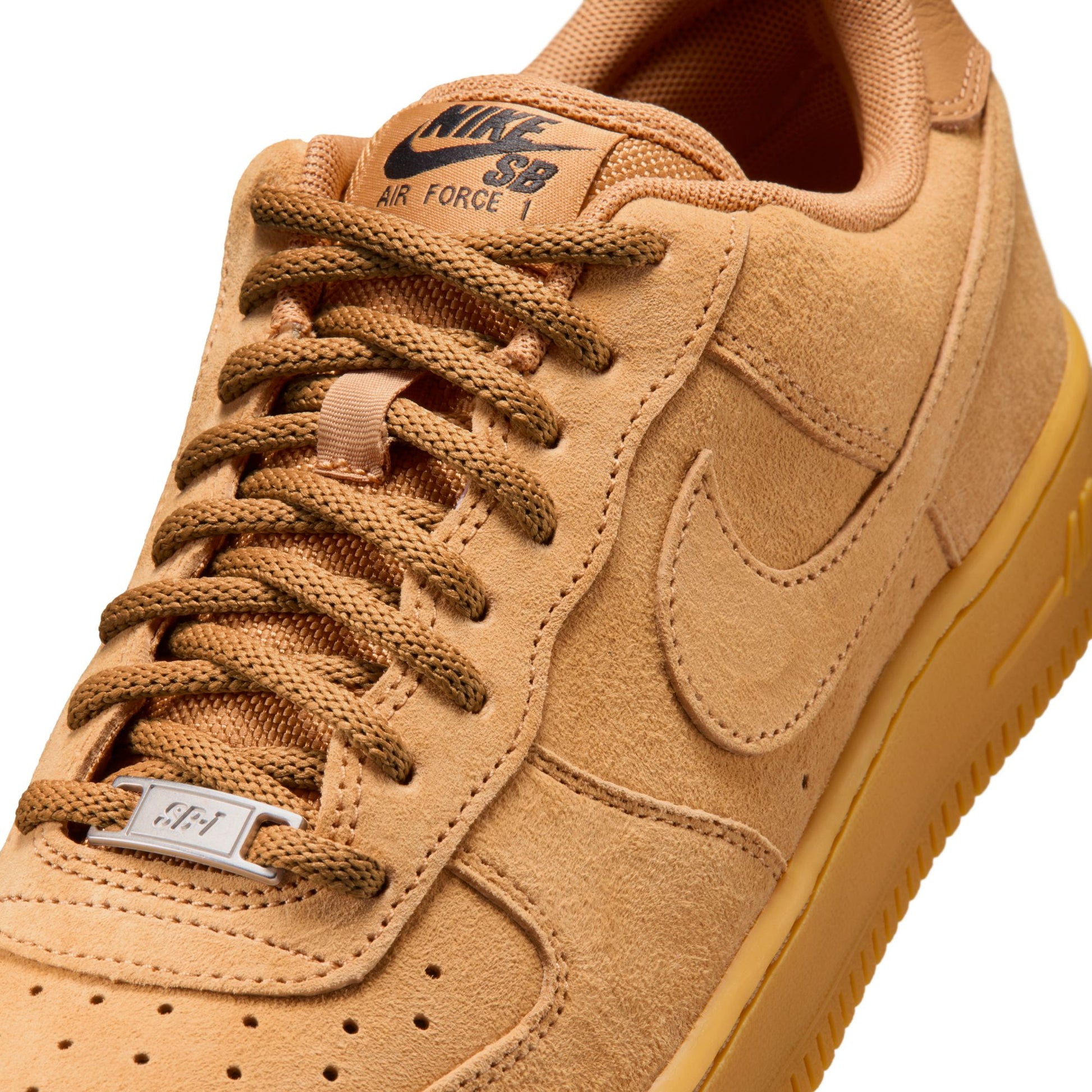 Tan Nike SB Air Force 1 sneaker on a white background