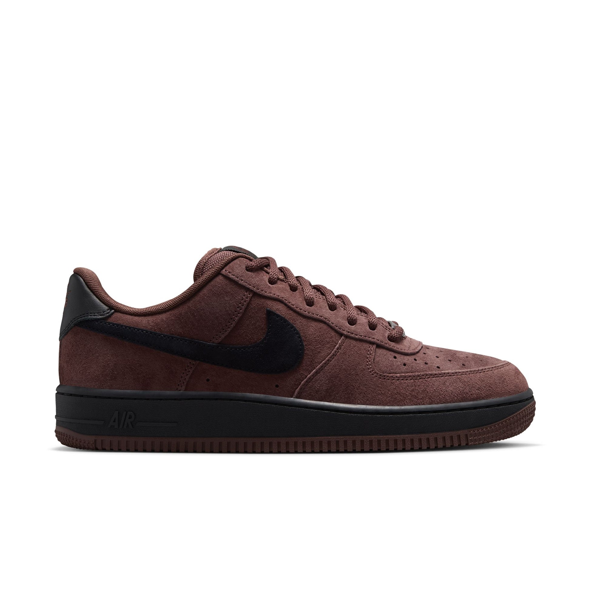 A Nike Dunk AF-1  in brown suede with translucent purple overlays and a black Swoosh, shown in a side profile on a white background.