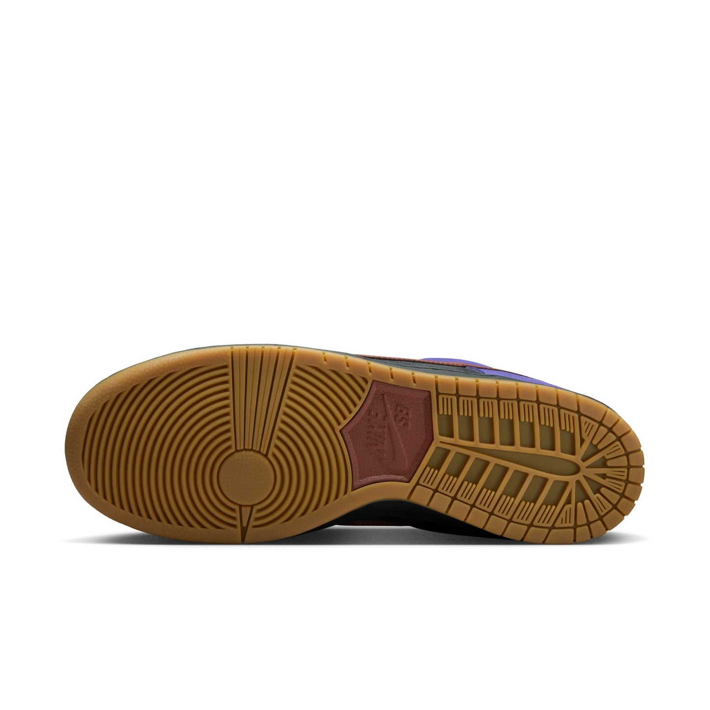 Close-up of a shoe sole with brown tread pattern on a white background
