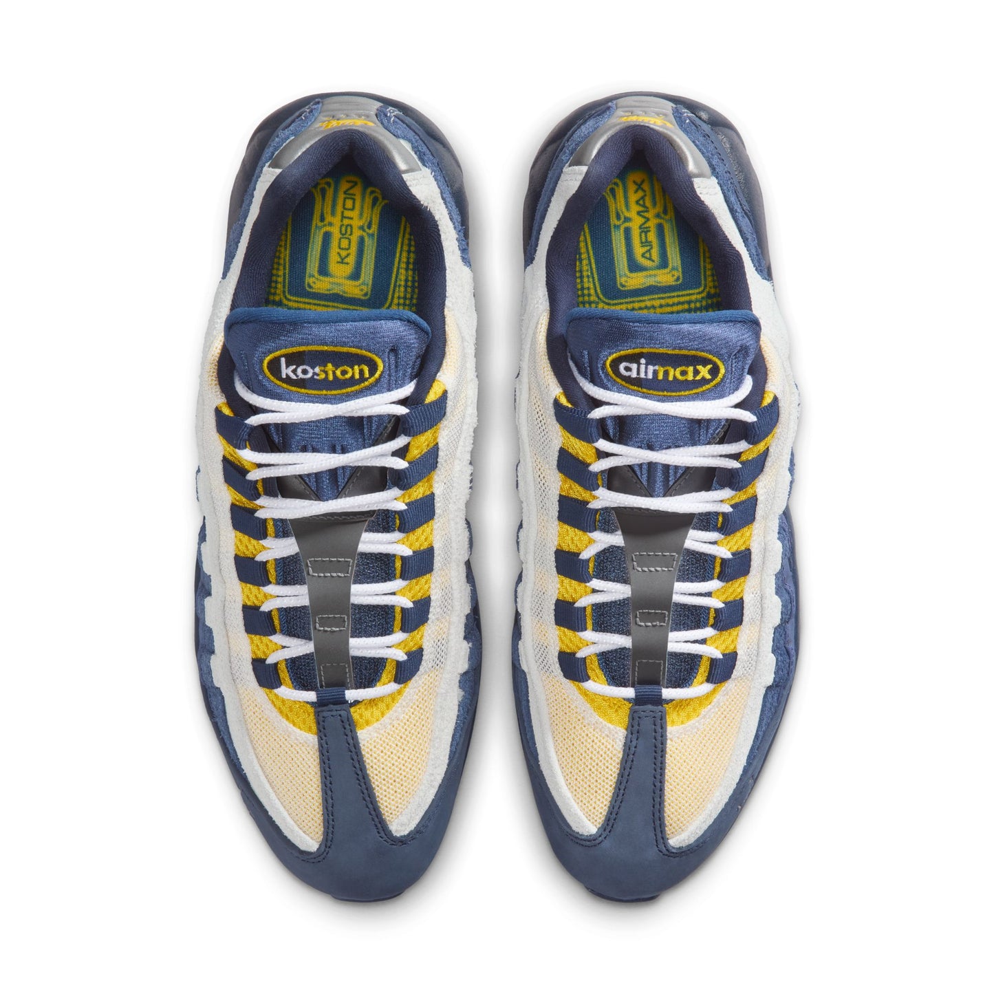 Pair of blue and yellow sneakers with visible branding on a white background