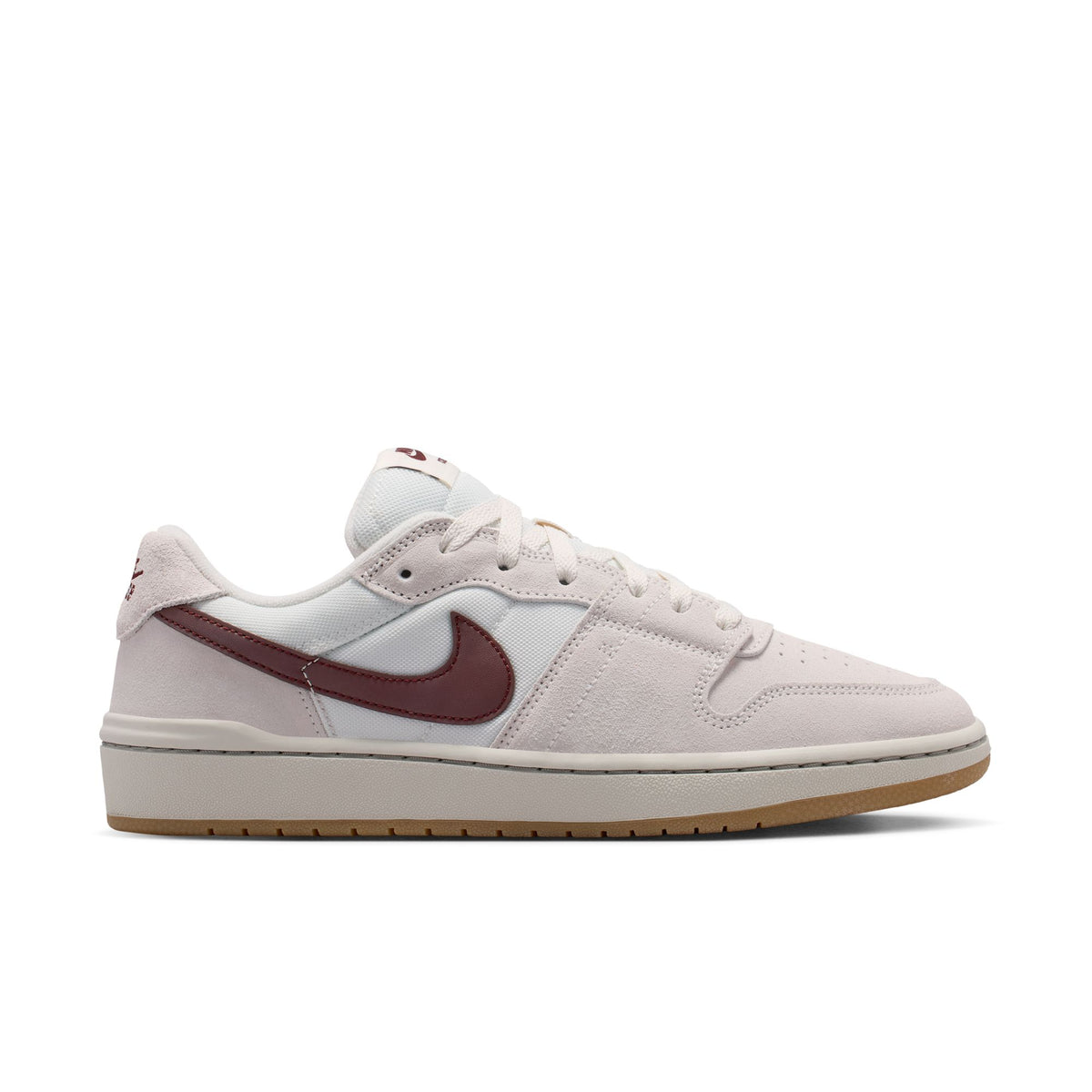 White sneaker with Nike logo on a light gray background