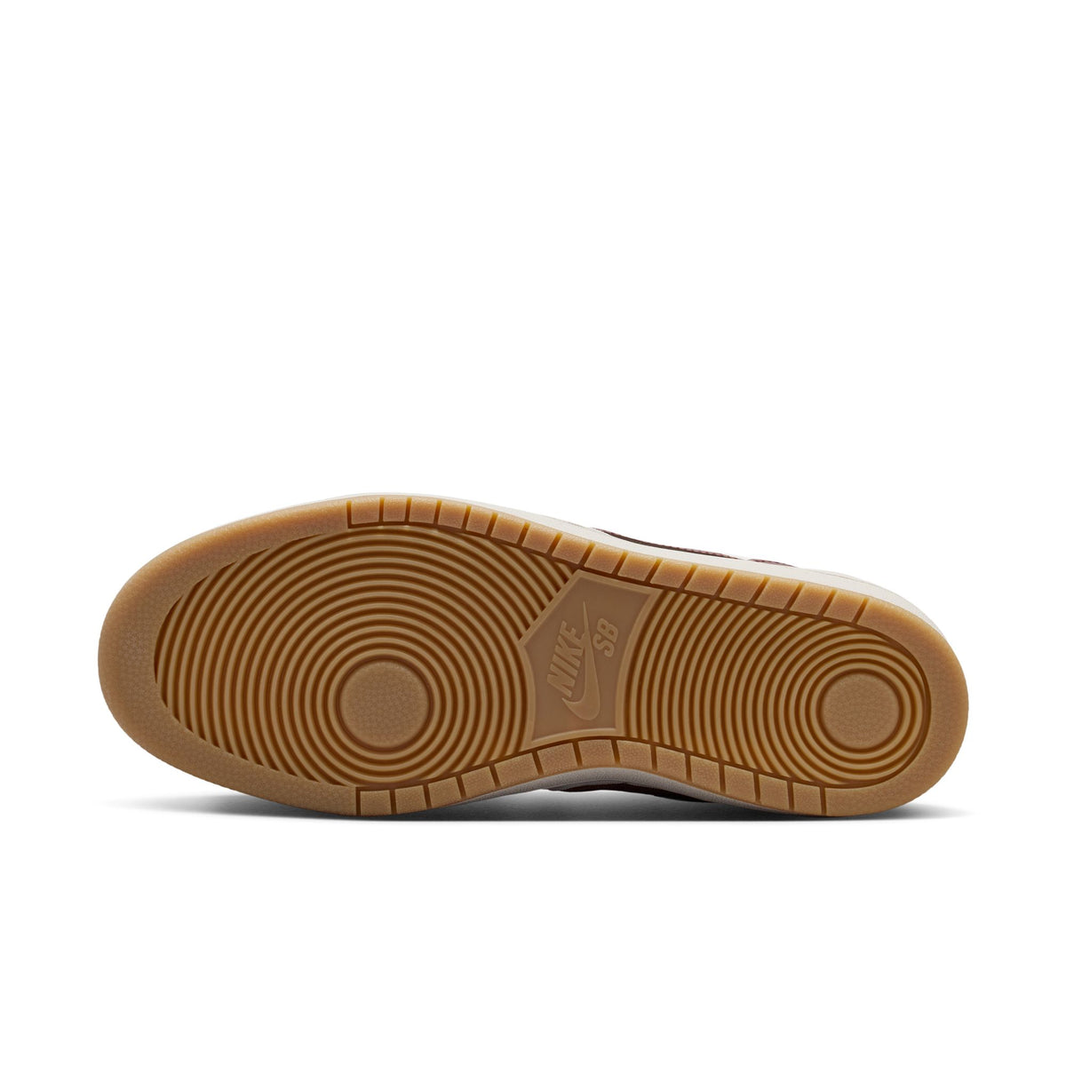 The bottom sole of a Nike SB sneaker, featuring a classic gum rubber outsole with circular tread patterns and an embossed Nike logo, shown against a plain white background.