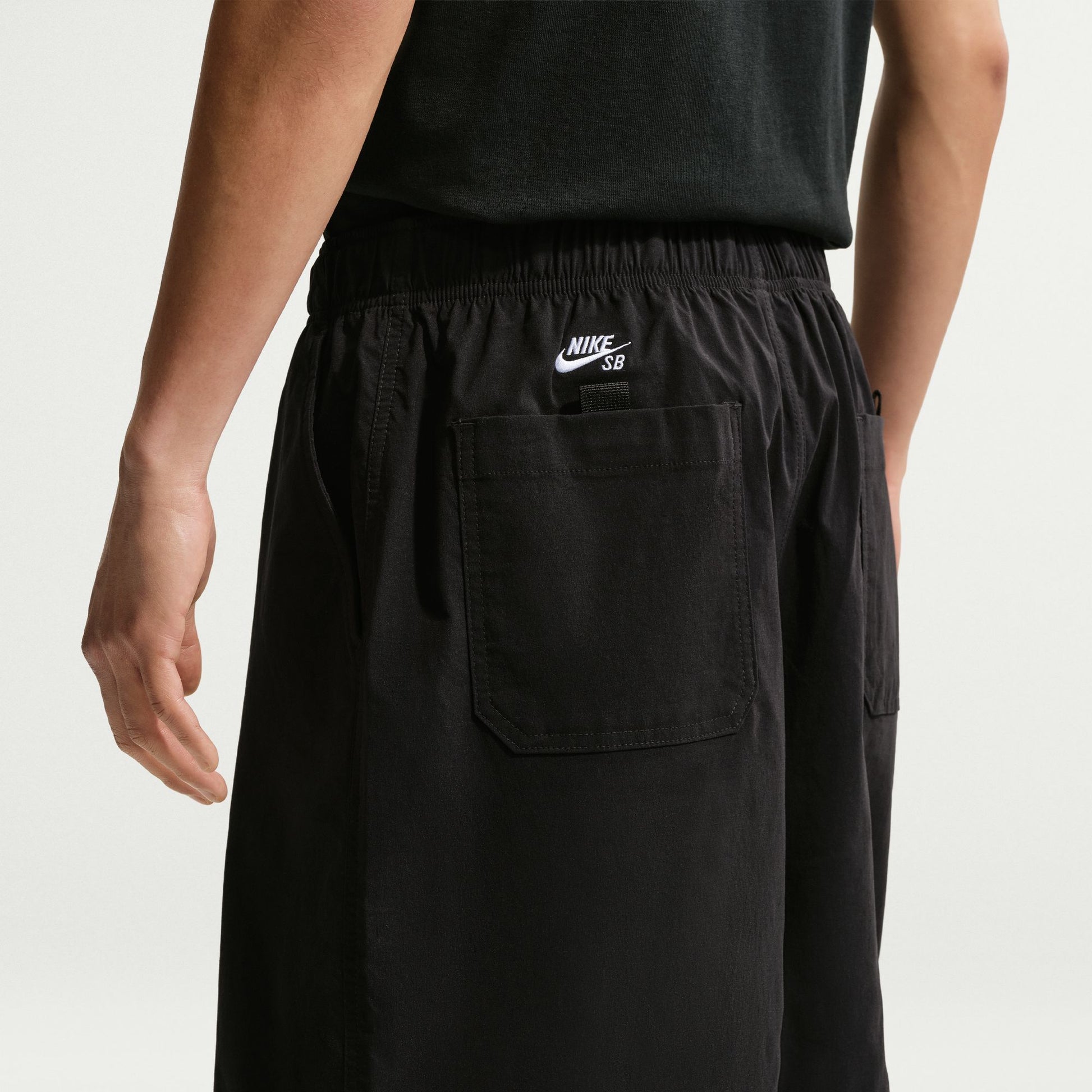 Black elastic waist with Nike logo on a white background
