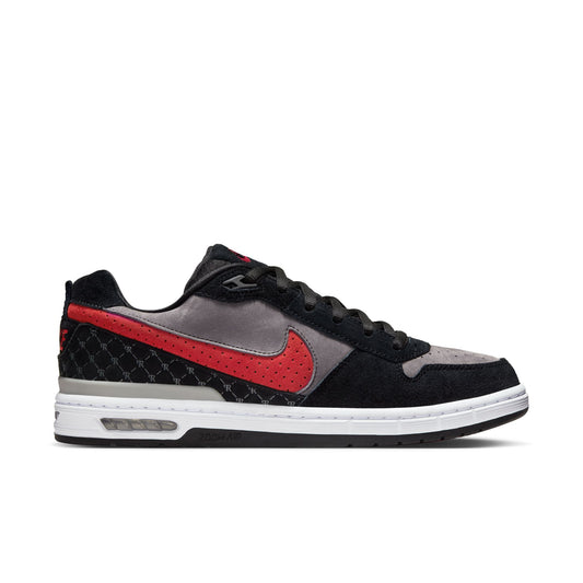Black and red sneaker with quilted pattern on a white background