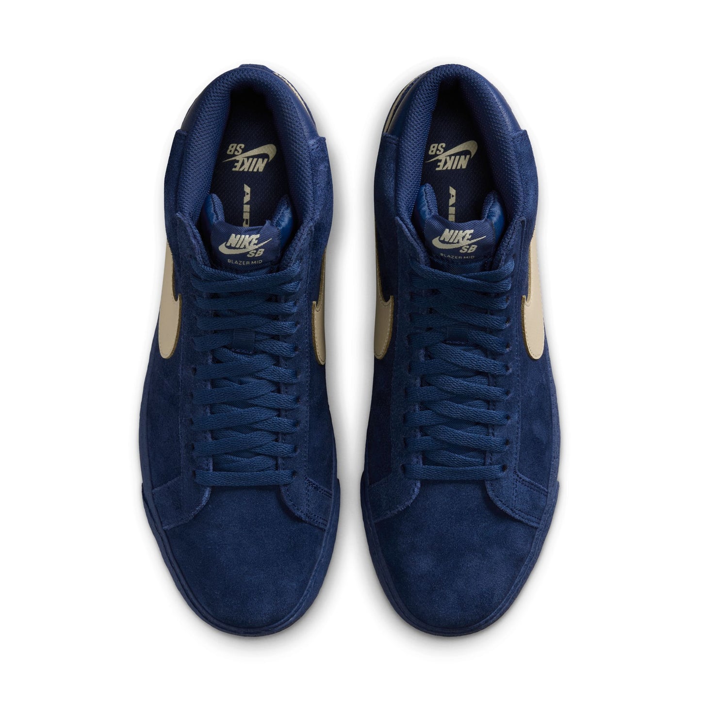 Pair of blue Nike SB sneakers on a white background, photo taken from above