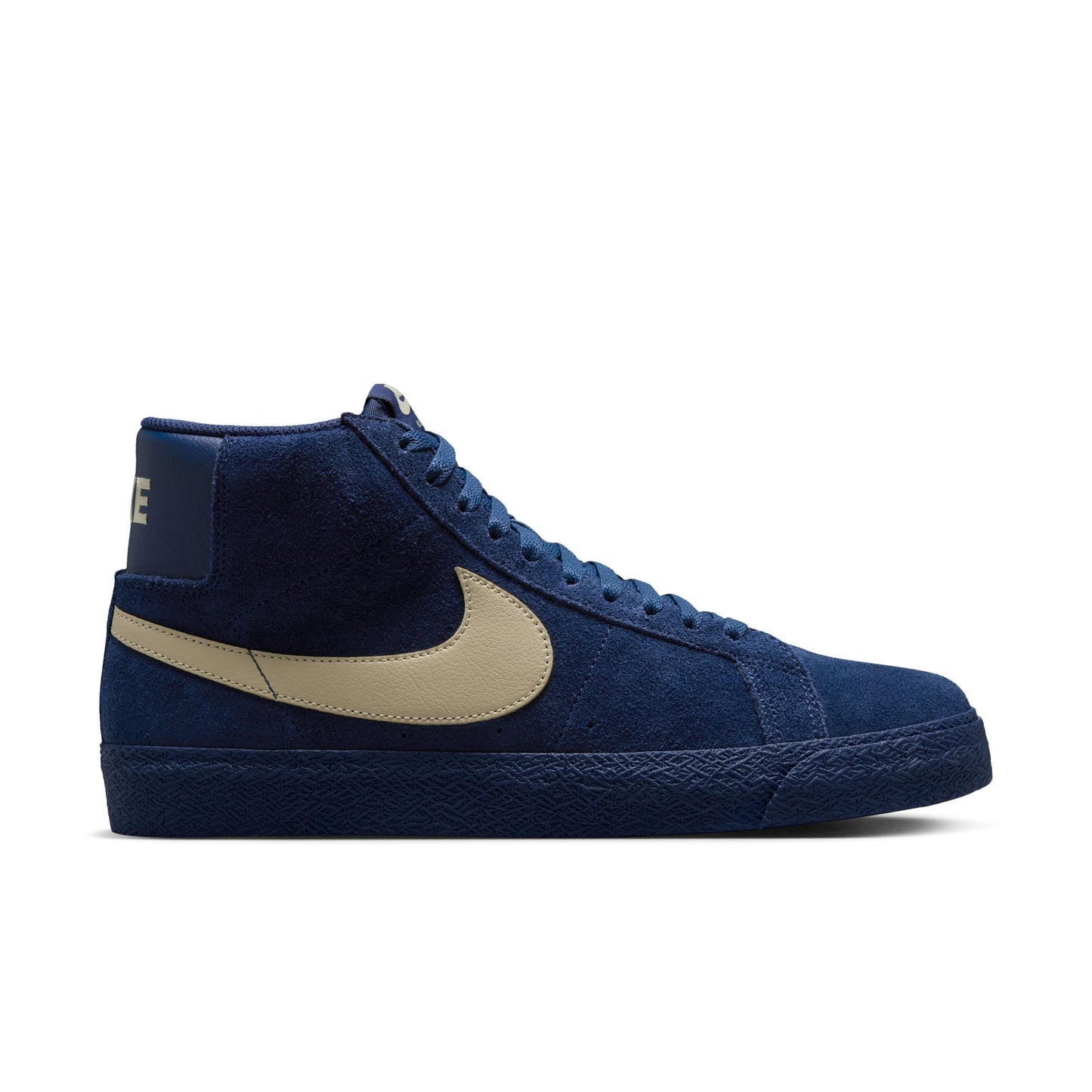 Blue high-top Nike sb blazer sneaker with beige swoosh logo on a white background