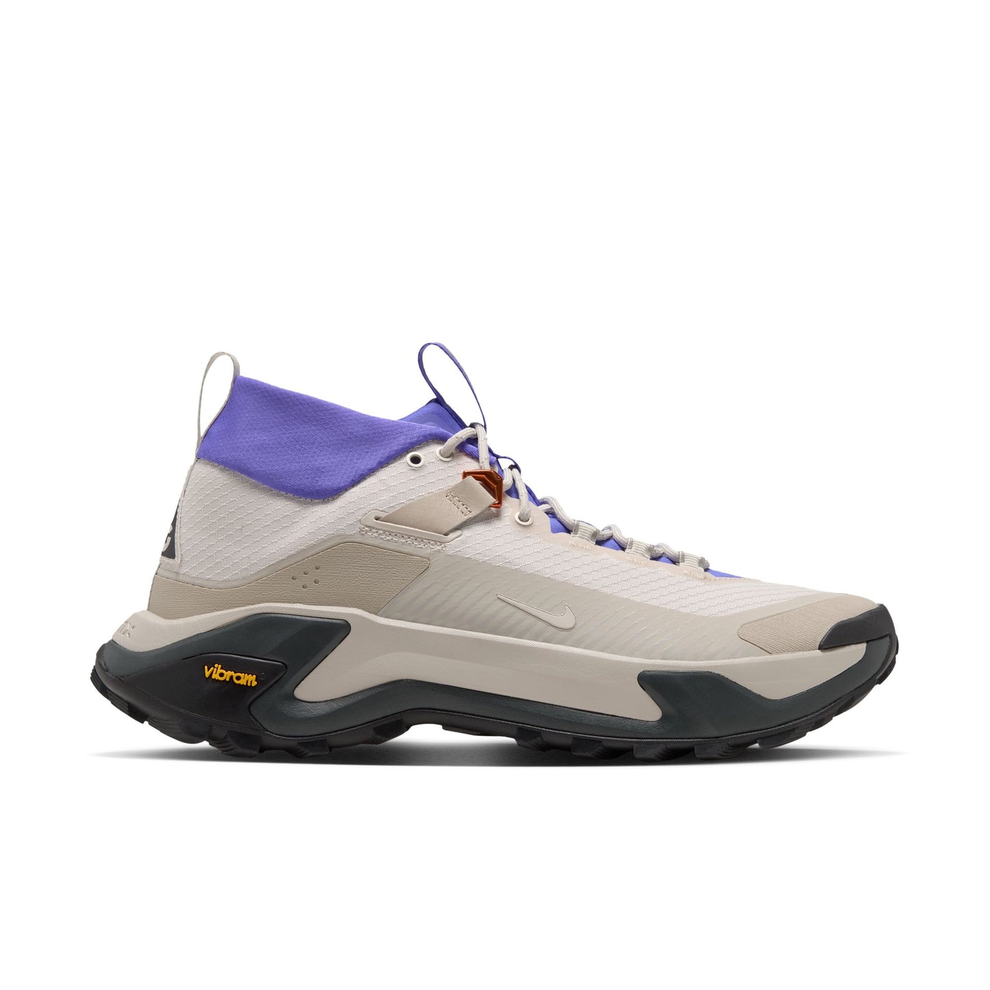 A Nike mid-top hiking shoe in light beige and white with a purple collar, black Vibram sole, and small orange logo accents.