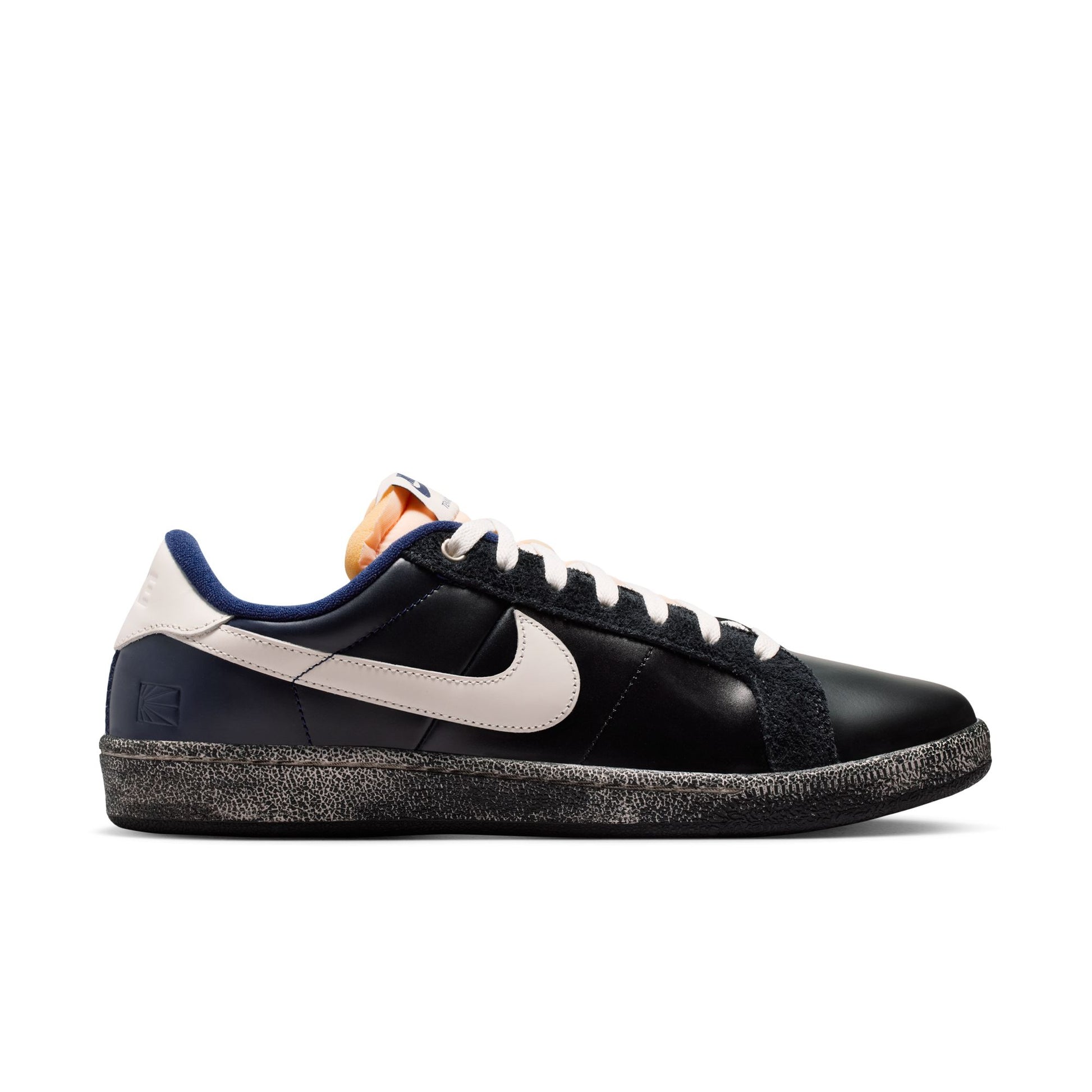 Black sneaker with a visible NIKE swoosh brand logo on a white background