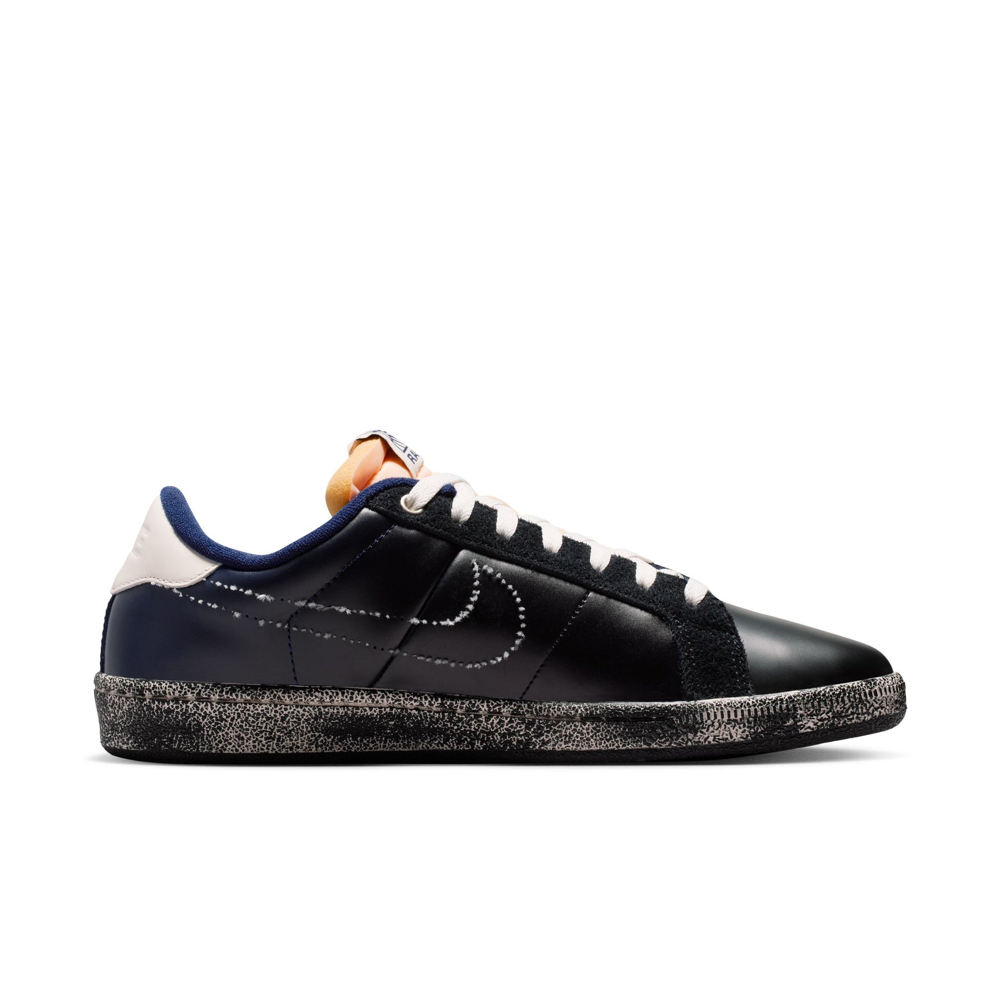 inside view of Black sneaker with white and blue accents on a white background