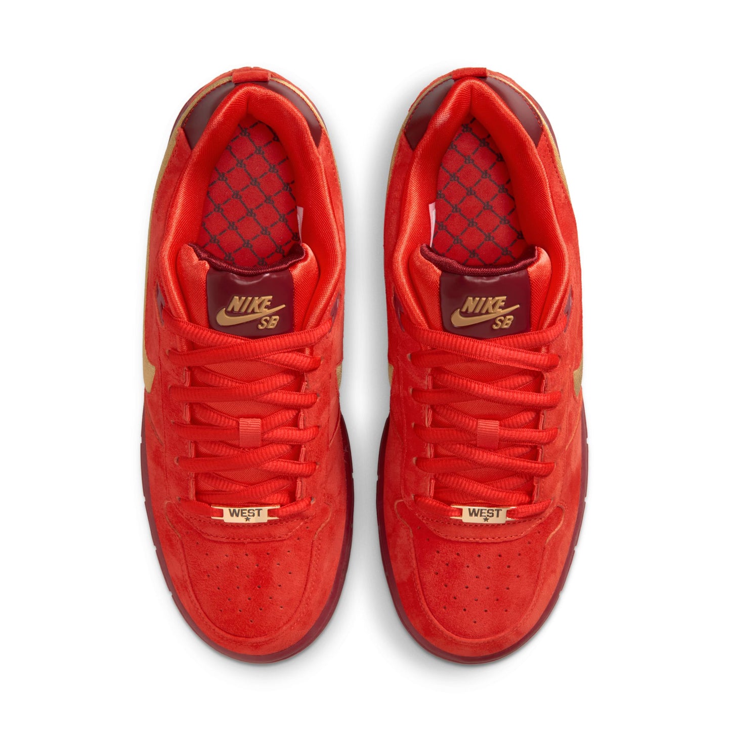 Red Nike sneakers with gold accents on a white background