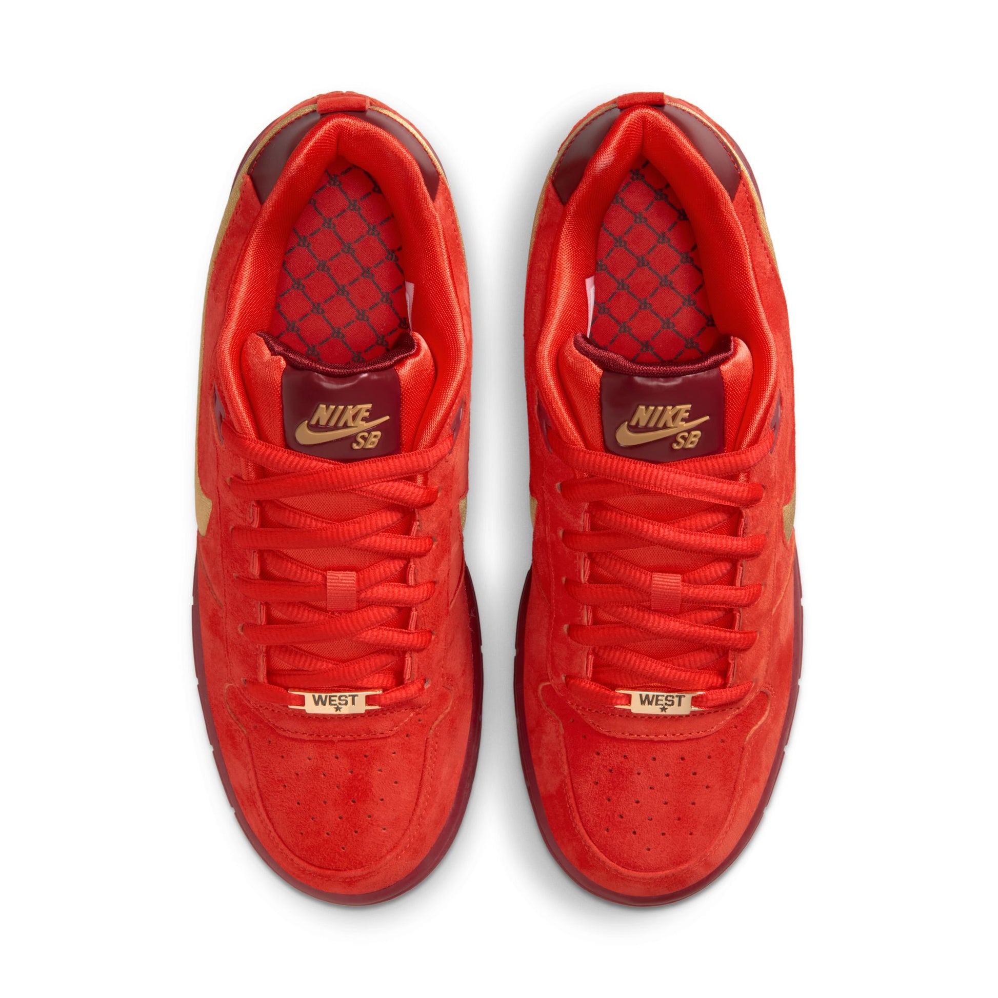 Red Nike sneakers with gold accents on a white background