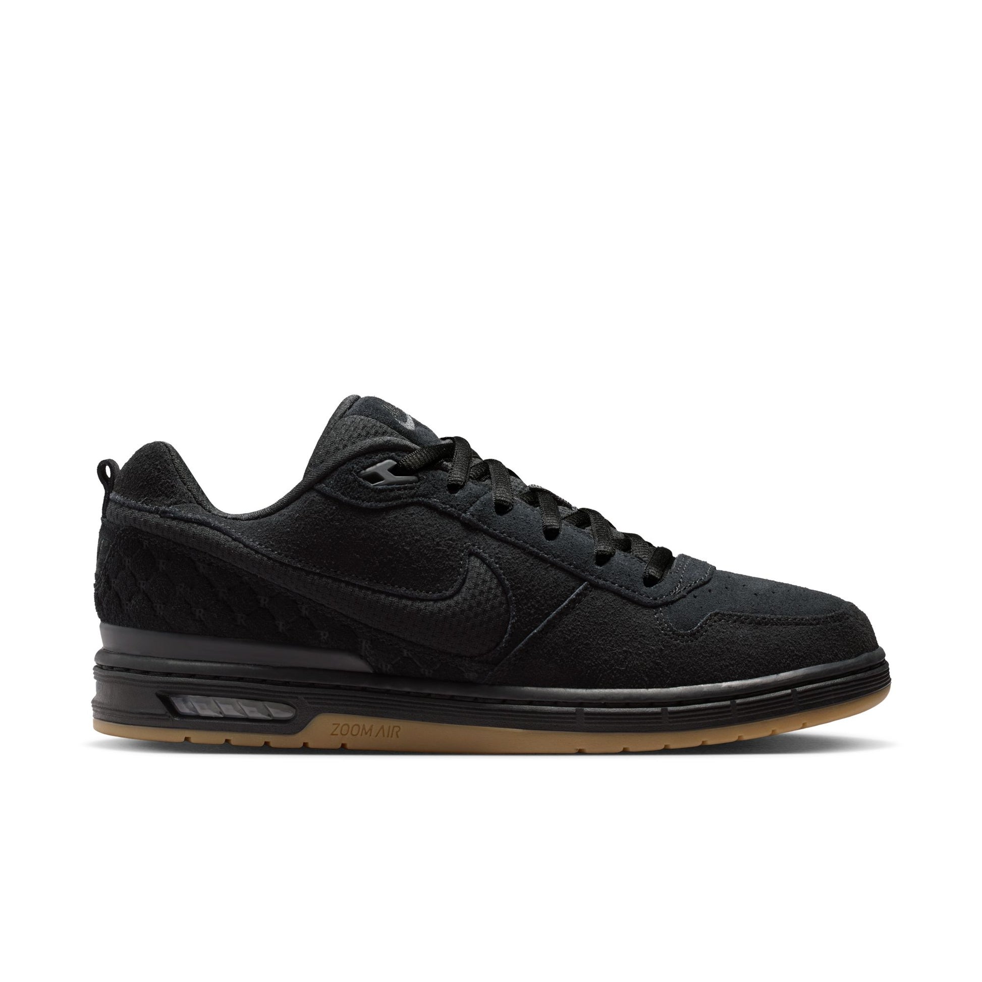 Black sneaker with a visible Nike logo on a white background