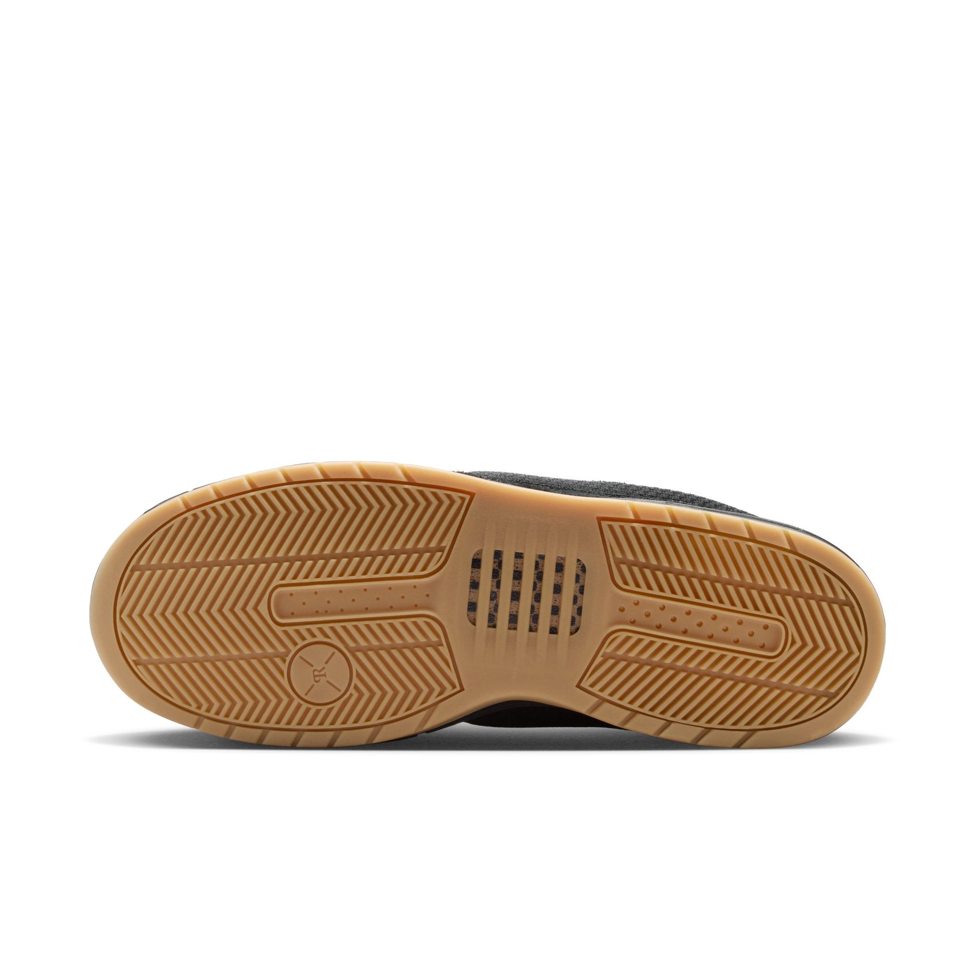 Close-up of a shoe sole with tread pattern on a white background