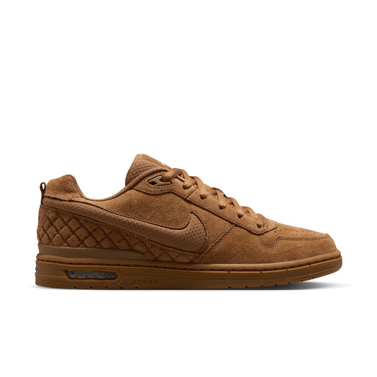 A single low-top nike sb paul rodriguez shoe in a monochromatic tan and brown colorway, shown from the side profile against a solid white background.