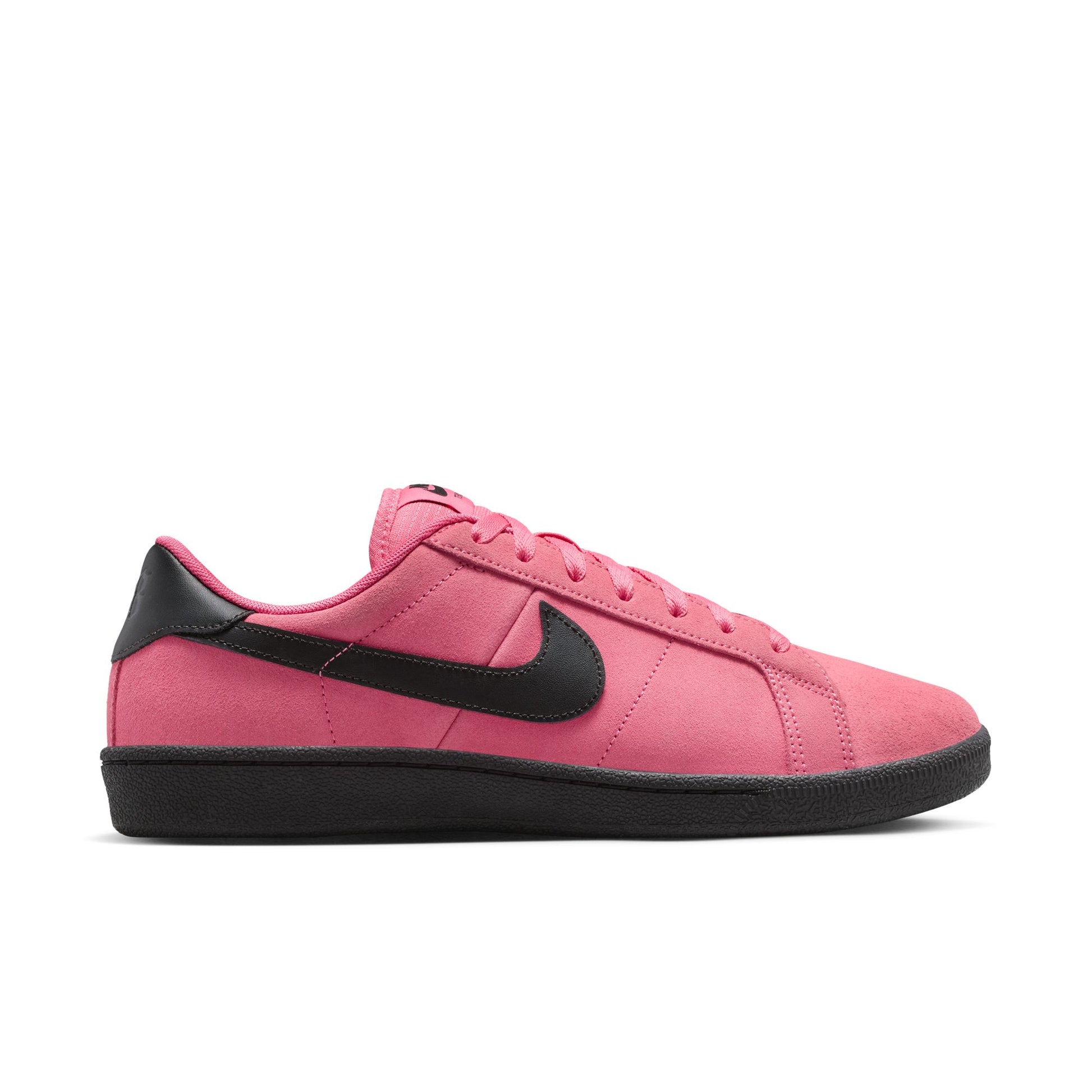 Pink sneaker with black swoosh logo on a white background