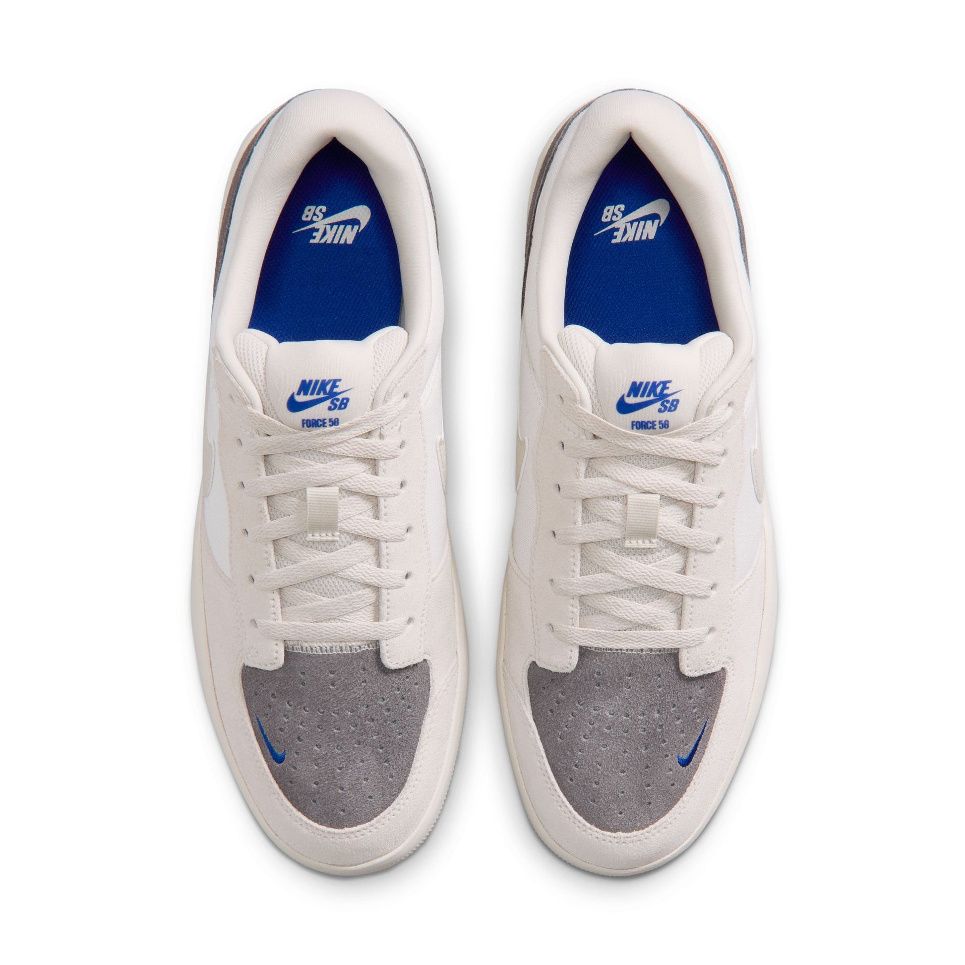 White sneakers with gray soles and blue swoosh logo on a white background