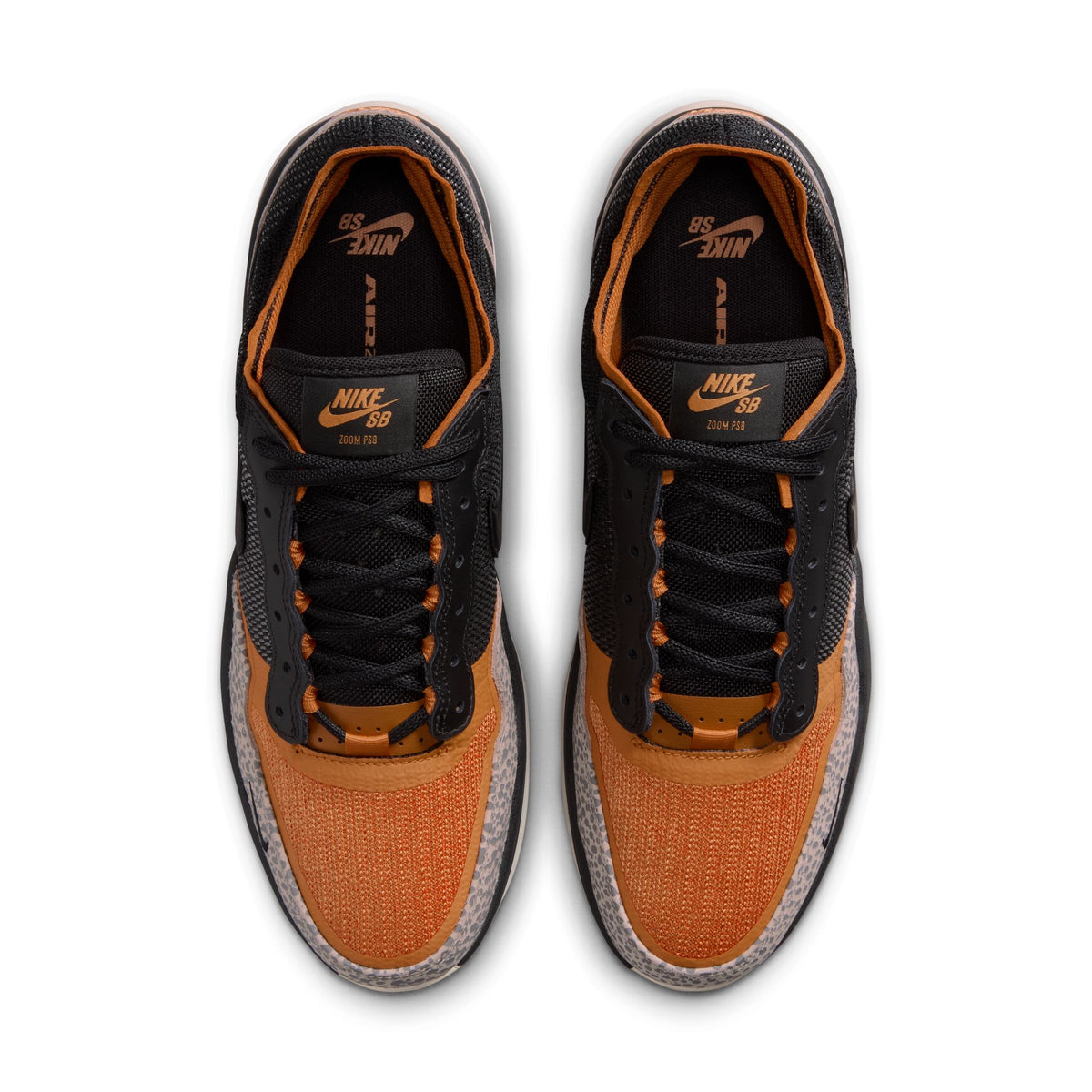 overhead view of Pair of black and orange Nike sneakers on a white background