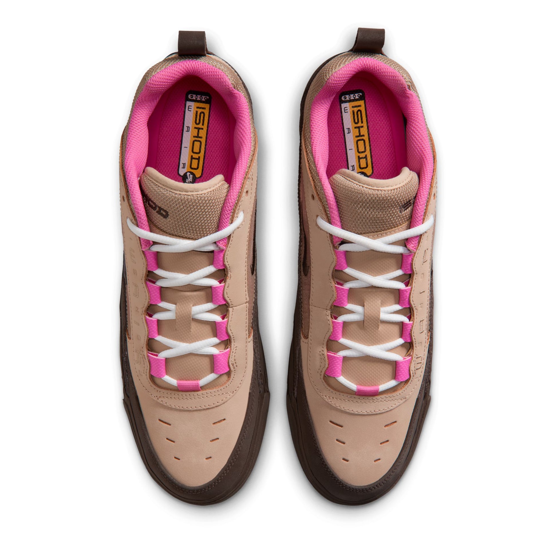 Pair of tan and pink sneakers with white laces on a white background