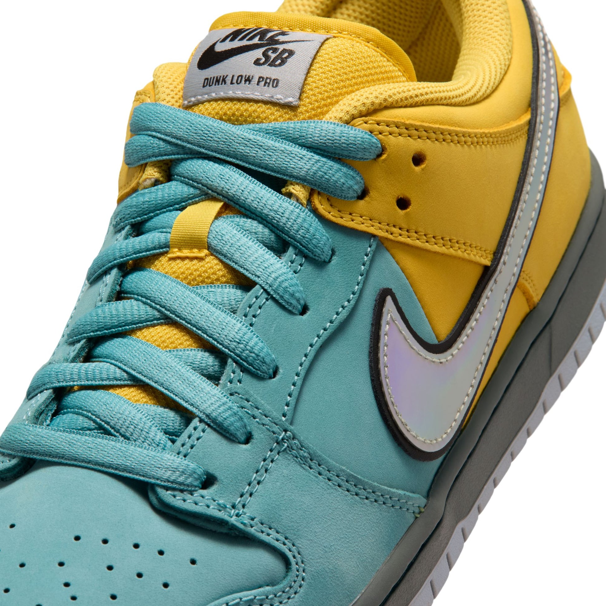 close up side view of blue and yellow nike SB dunk low