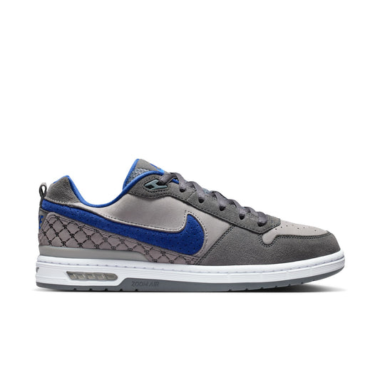 Gray and blue sneaker with a white sole on a white background