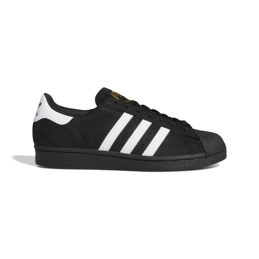side view of black nubuck adidas superstar shoe with white stripes