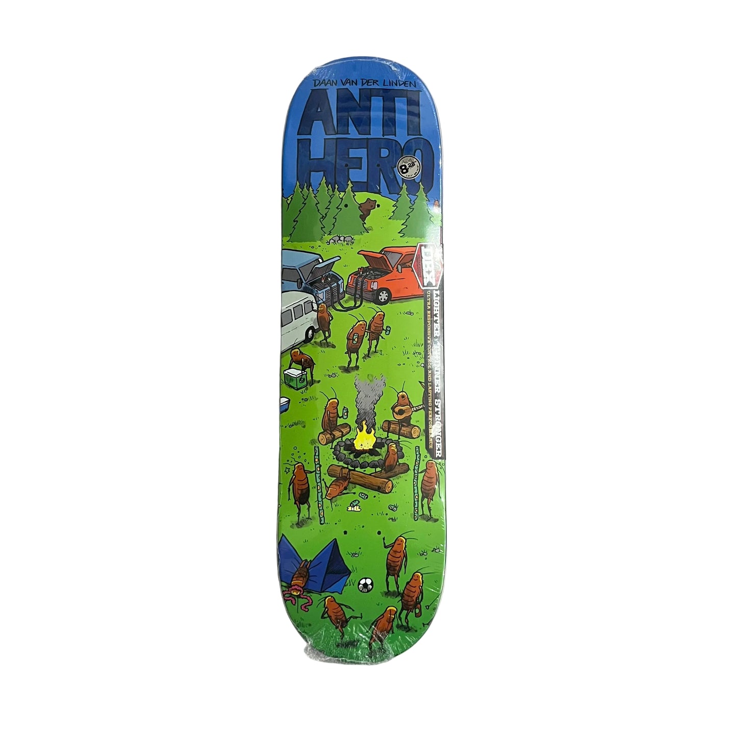 An Anti Hero skateboard deck in its clear plastic shrink wrap, displayed vertically against a textured white surface. The deck features a vibrant green and blue landscape illustration with cartoon bugs and a campfire.