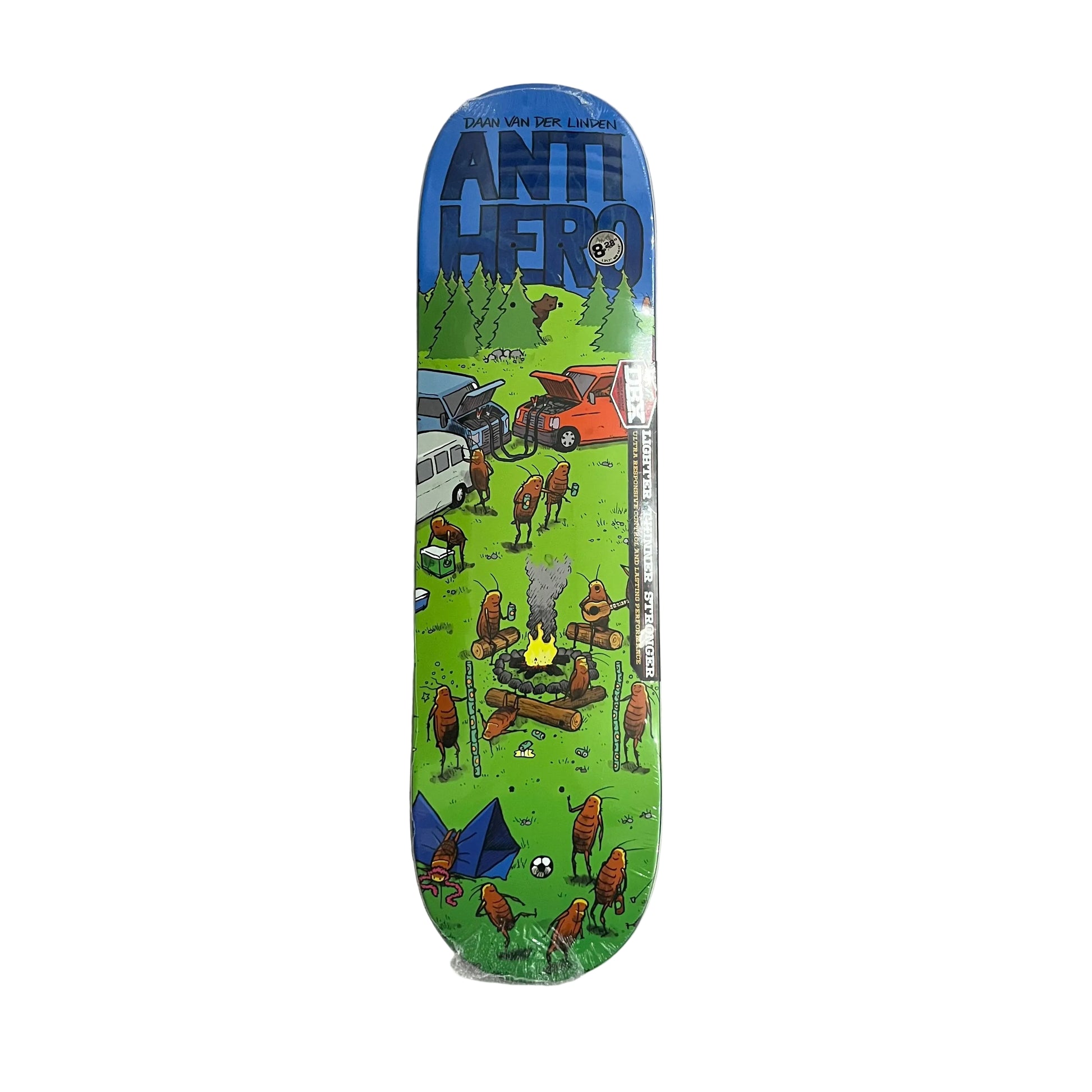 An Anti Hero skateboard deck in its clear plastic shrink wrap, displayed vertically against a textured white surface. The deck features a vibrant green and blue landscape illustration with cartoon bugs and a campfire.