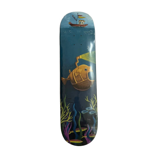 A skateboard deck with a colorful underwater graphic design, featuring a yellow submarine, blue ocean, and sea plants, photographed flat on a white surface