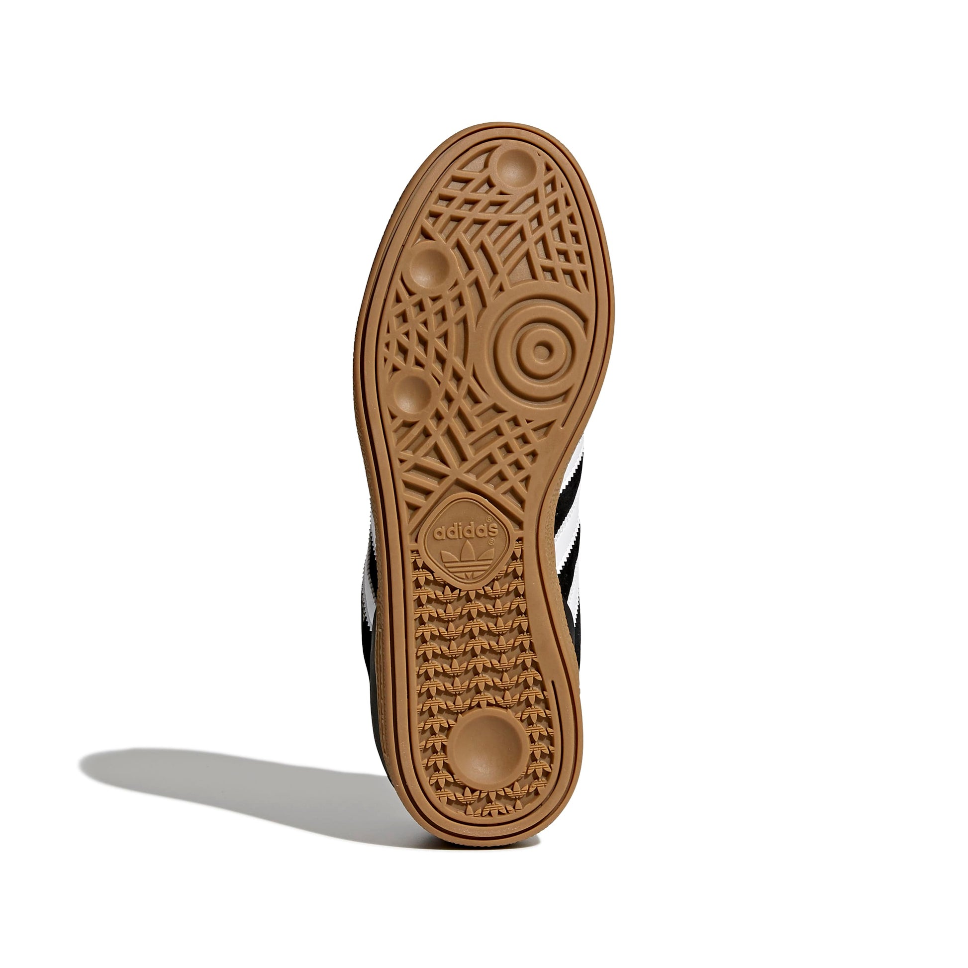 view of gum rubber outsole on soccer inspired skateboard sneaker