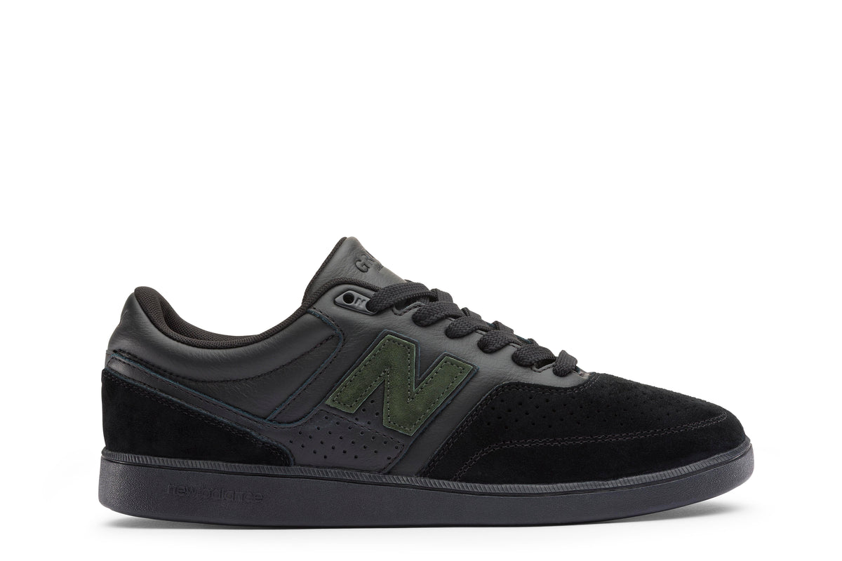 Black new balance athletic shoe on a white background