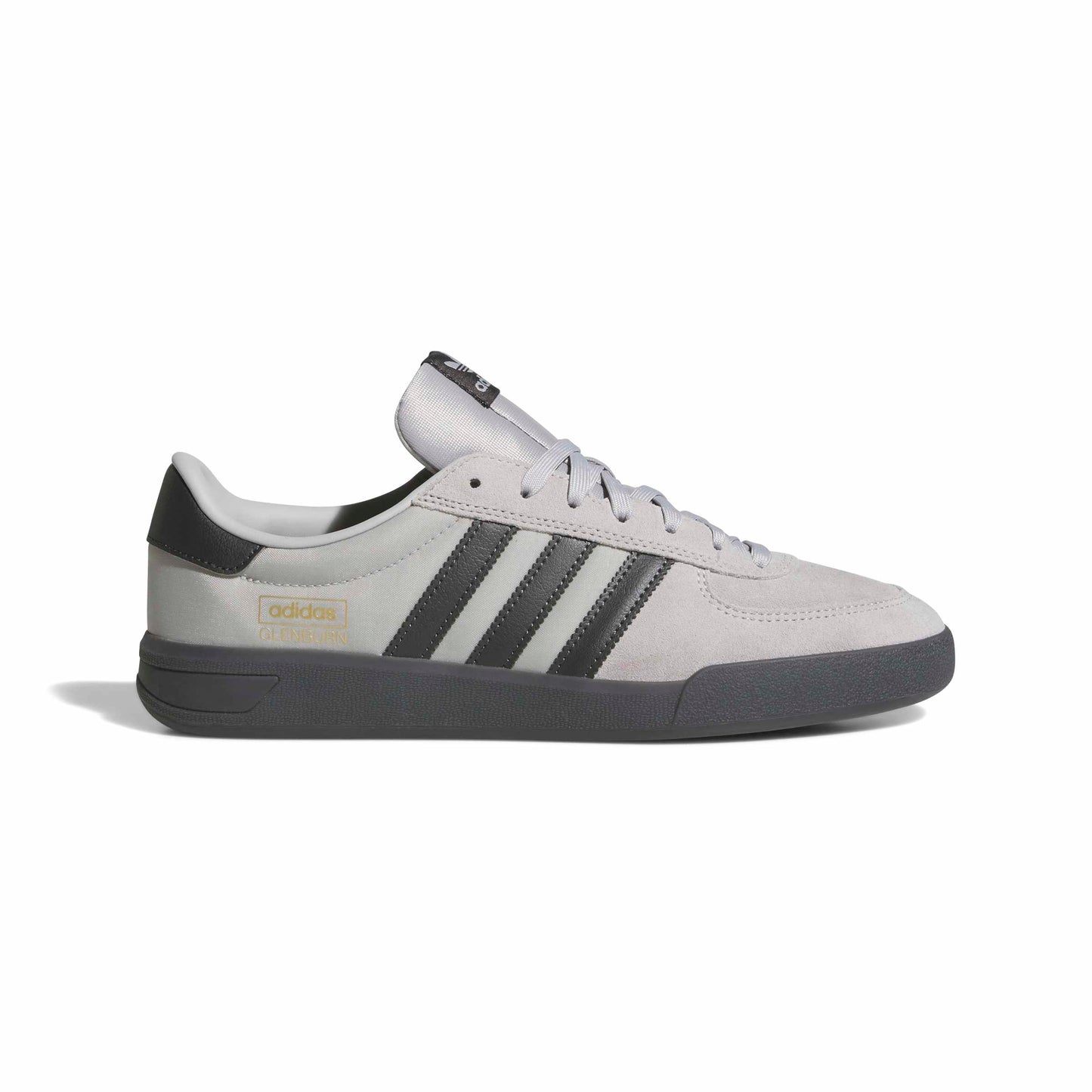 Gray Adidas sneaker with black stripes on a white background