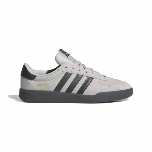 Gray Adidas sneaker with black stripes on a white background