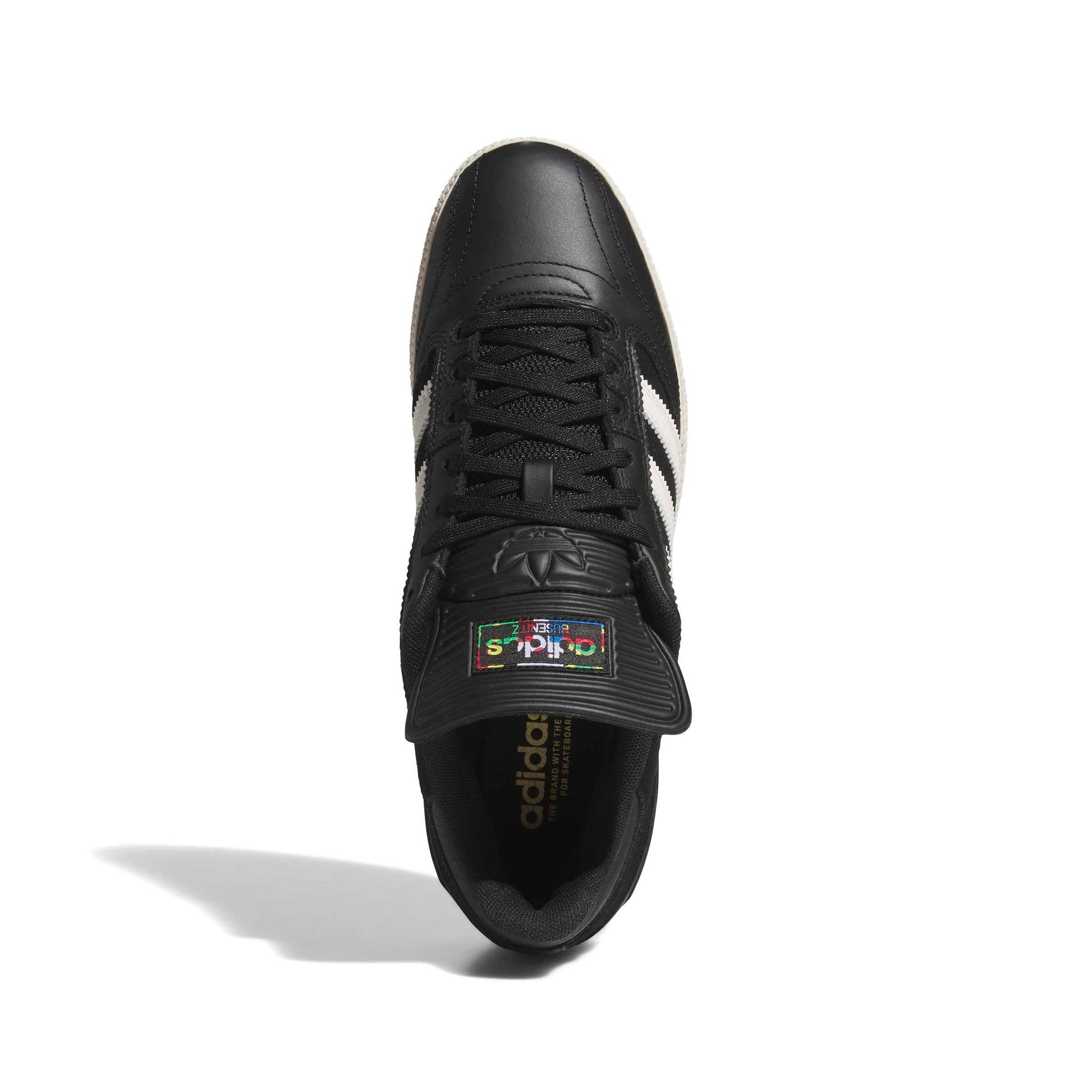 Black Adidas sneaker with white stripes on a white background