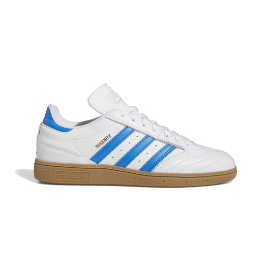 side view of white and gum leather soccer style shoe with gum rubber outsole