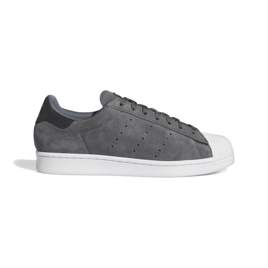 side view of grey and white superstar sneaker