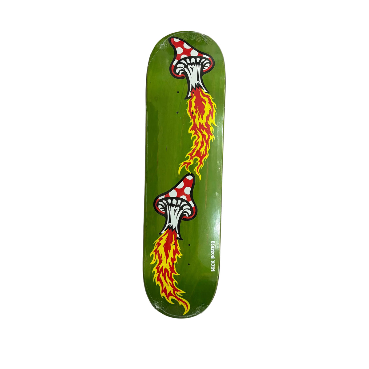 A green skateboard deck featuring a graphic design of two white mushrooms with red spots breathing out orange and yellow flames, photographed from above on a white surface.