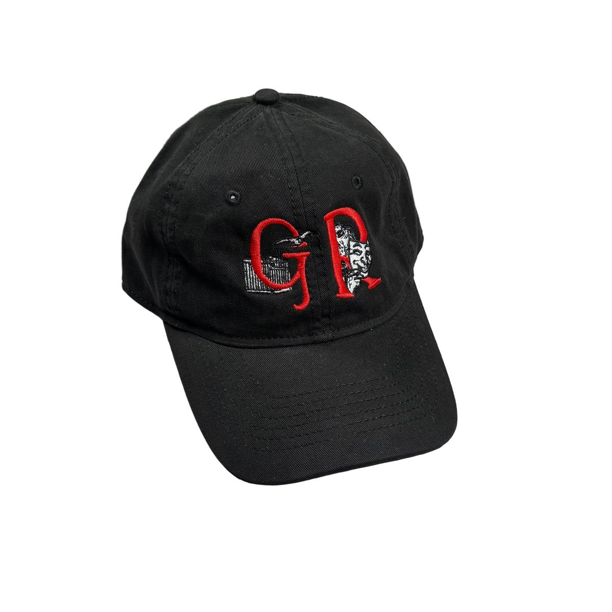 A black baseball cap with red and white embroidered lettering on the front, resting on a white surface.