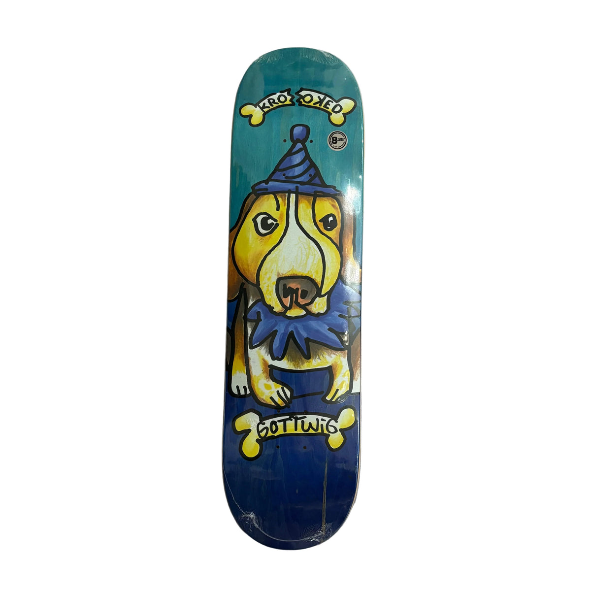 A skateboard deck featuring a hand-painted illustration of a yellow dog in a blue clown costume, with the brand name 'KROOKED' visible at the top.