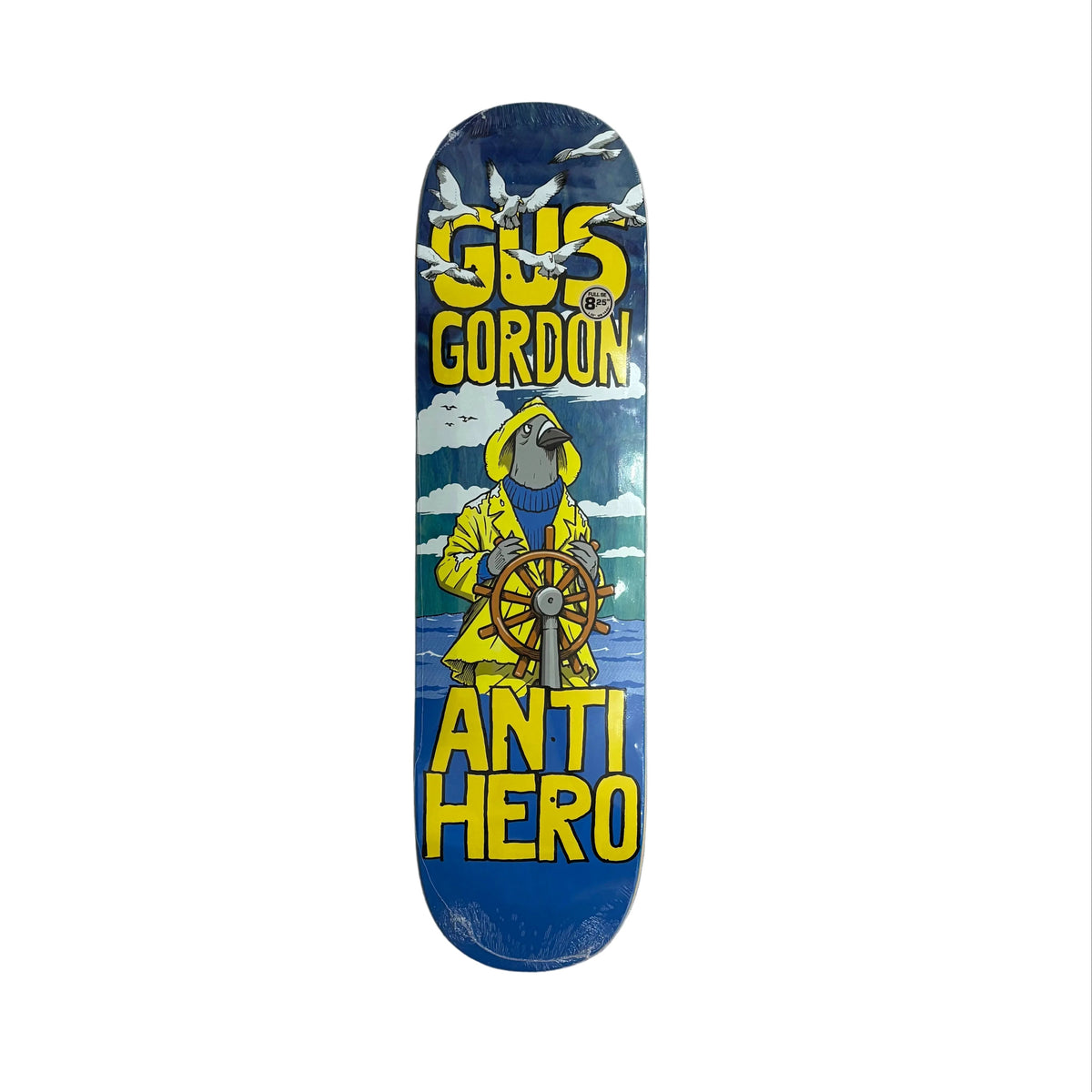 A Gus Gordon Anti Hero skateboard deck featuring a blue background with a yellow parrot in a raincoat at the helm, surrounded by white seagulls, photographed flat on a white surface