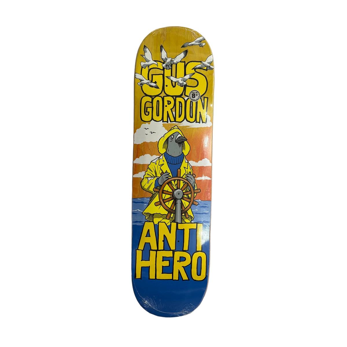 A Gus Gordon Anti Hero skateboard deck featuring a colorful graphic of a pigeon in a yellow raincoat steering a ship, with seagulls flying overhead, set against a white background.