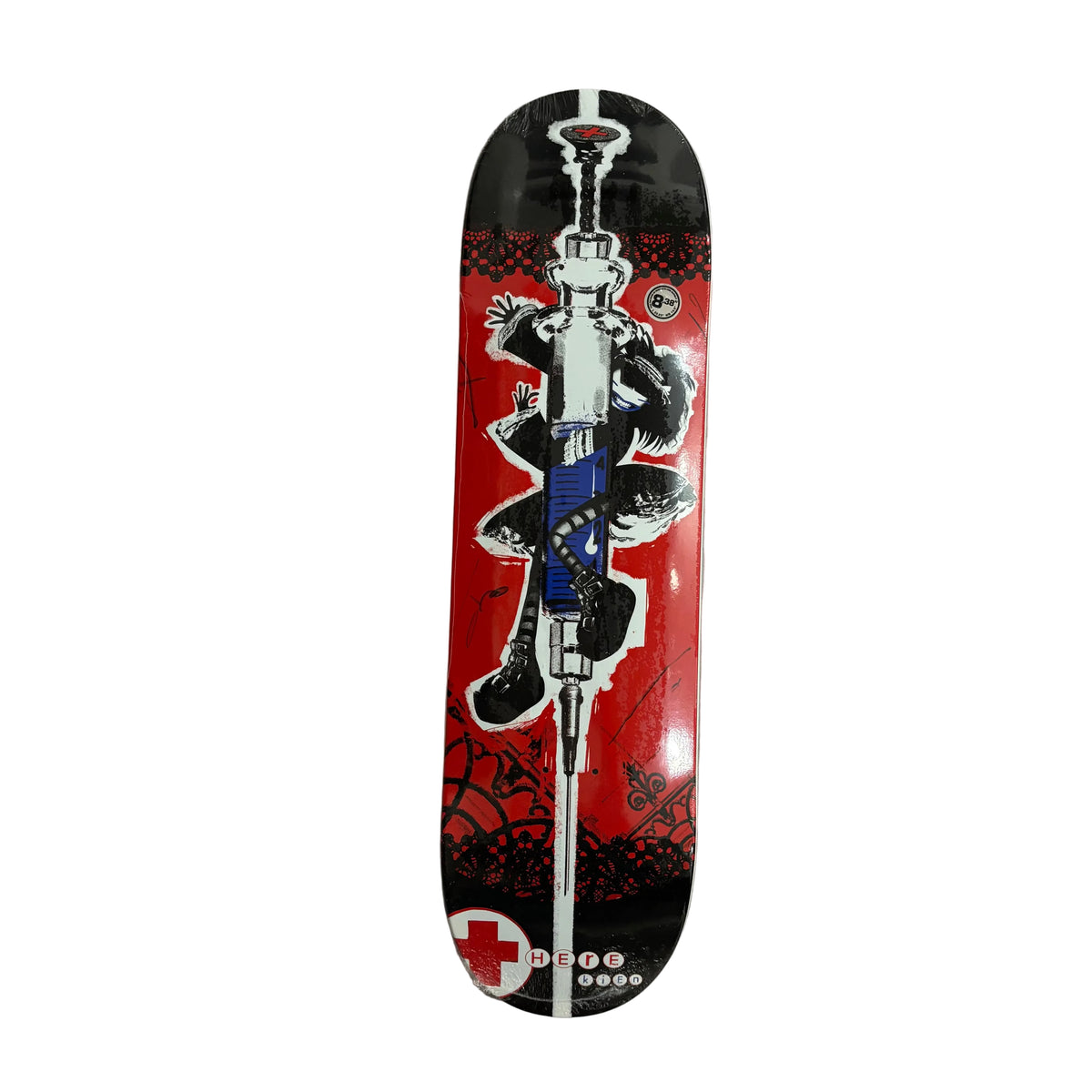 A skateboard deck featuring a graphic illustration of a syringe on a red and black background, photographed from above on a white surface