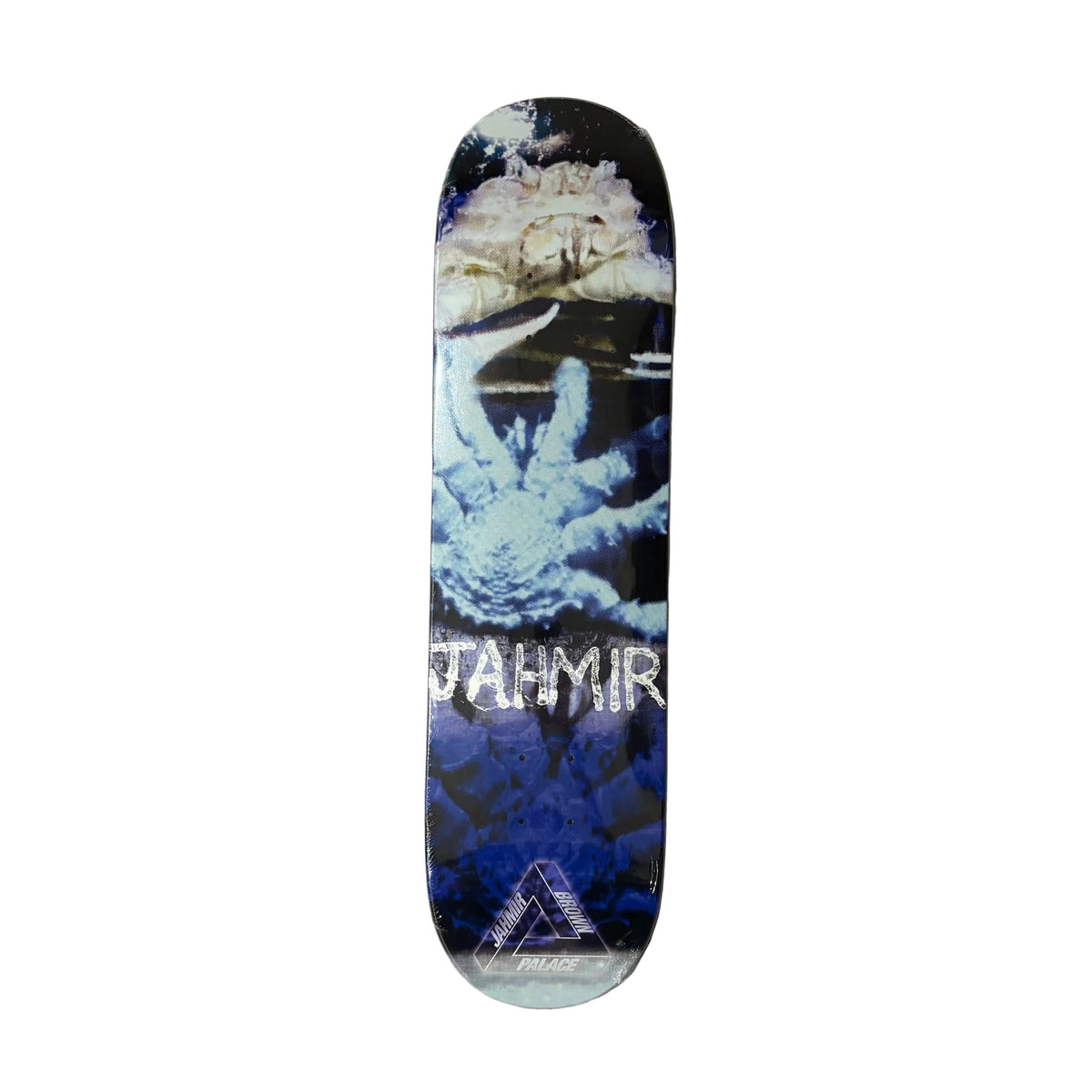 A skateboard deck featuring a graphic print with a hand, blue and black tones, and the word 'JAHMIR' in white, photographed from above on a gray textured surface.